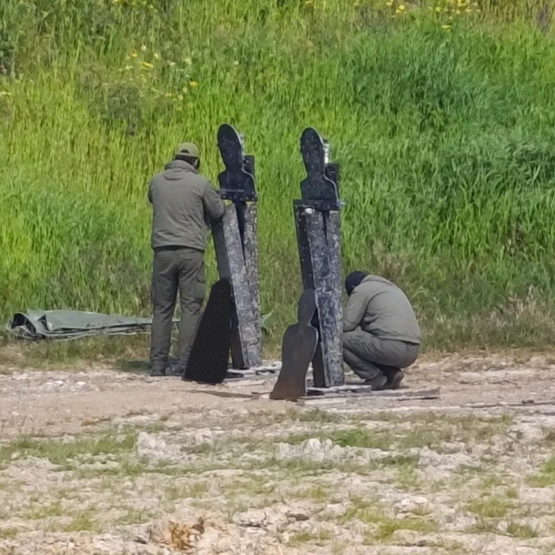 AYZET technical team setting up targets on a training range